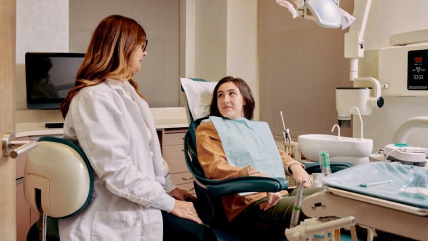 Patient and dentist talking about treatment plan